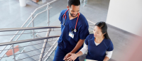 nurses walk up stairs together